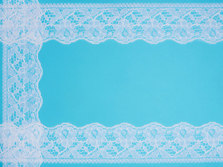 White laces on a blue background in three row