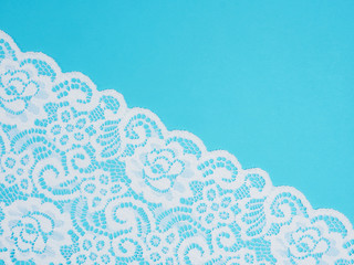 White laces on a blue background diagonally in row