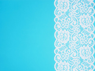 White laces on a blue background vertically in row
