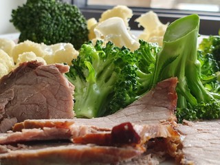 Obraz na płótnie Canvas Nutritious sports food. Baked meat, boiled cauliflower, and steamed broccoli. Healthy lifestyle. Food for life