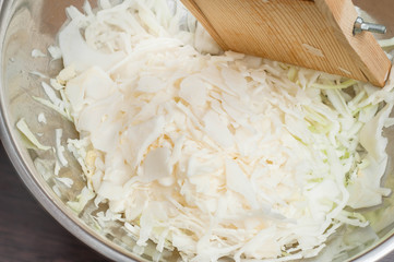 Cooking healthy salad at home in the kitchen