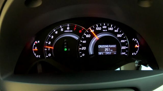 Close Up For Modern Car Dashboard Meter. Footage taken during low light.