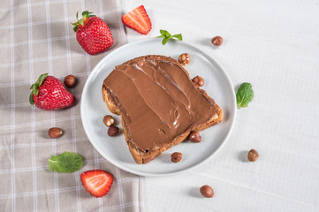 Sweet sandwich with chocolate and strawberries