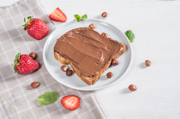 Sweet sandwich with chocolate and strawberries