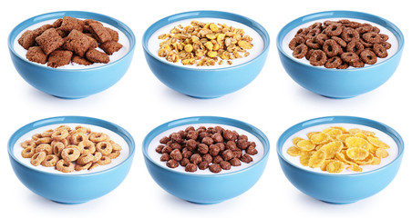 Bowl with corn pads, rings, balls, oat granola, cornflakes and yogurt isolated on white background.