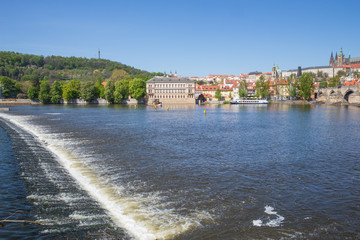 Obraz premium City Prague, Czech Republic. Old buildings and Vltava river locks view. Travel photo 2019. 26. April