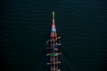 Kayaking with rowers sailing along the river, athletes are practicing at sunset © Alexeiy