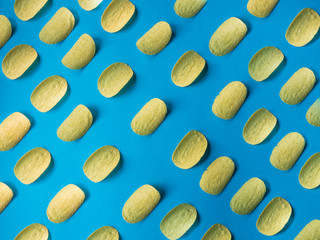 Potato chips pattern on blue background