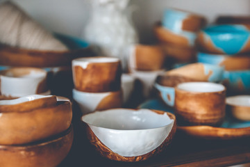 Brown crockery made of clay on potter wheel, was roasted under milk, blue glaze