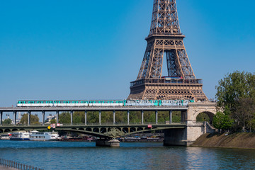 Paris metro crossing Pont de Bir-Hakeim and Eiffel Tower