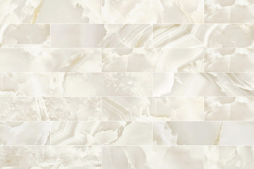 White and beige rectangle marble wall tile texture background.