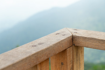 close up of balcony with blur mountain and forest background in the fresh day.