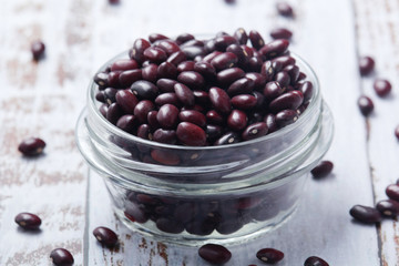 A bowl with red dry uncooked beans