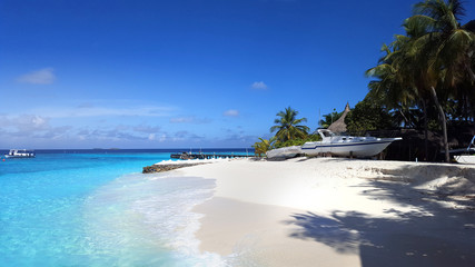 White sand beach with clear blue water sea and sky in Maldives island for relaxation and destination of summer holiday co