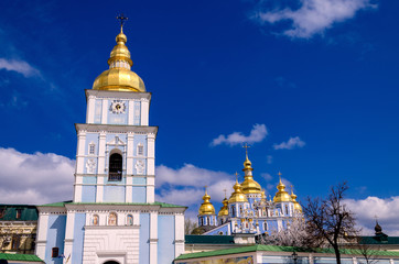 Fototapeta na wymiar Orthodox Christian Cathedral with golden domes and crosses, St. Michael's Golden-domed Cathedral