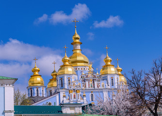 Fototapeta na wymiar Orthodox Christian Cathedral with golden domes and crosses, St. Michael's Golden-domed Cathedral