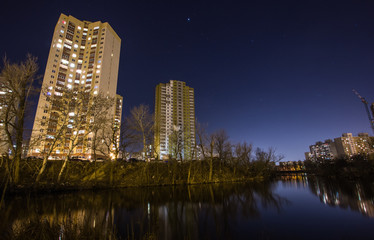 skyscrapers at night near water