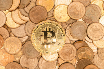 Gold bitcoin, cryptocurrency on coins background.