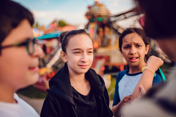 Friends hang out at amusement park