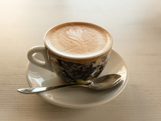 cup of mococino cappuccino coffee on the table