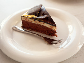 cake on a saucer on the table.