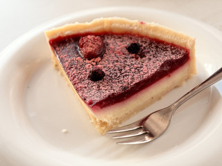 cake on a saucer on the table.