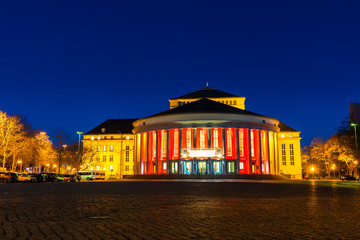 Germany, Ancient theatre building in old town of saarbrucken city in magic night light