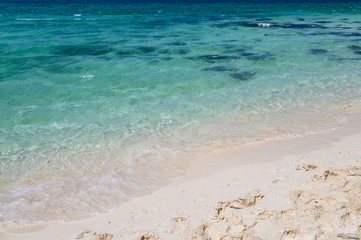 Fototapeta na wymiar White sand beach in tropical sea