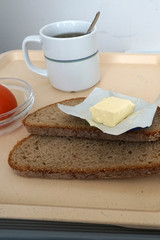 Dinner in a hospital in Germany with sausage and bread