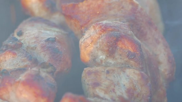 Barbecue Juicy Pork Meat On Iron Skewers Cooking On Open Fire