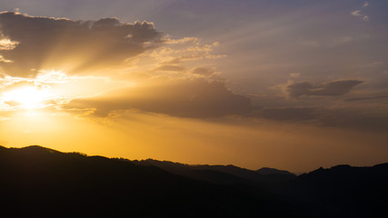 Beautiful landscape in the mountains at sunset. View of colorful sky with amazing clouds.