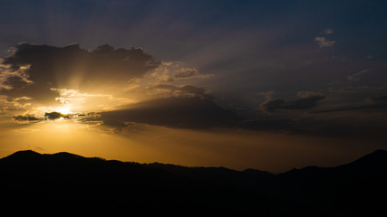 Beautiful landscape in the mountains at sunset. View of colorful sky with amazing clouds.