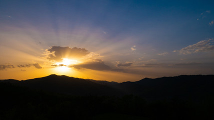 Beautiful landscape in the mountains at sunset. View of colorful sky with amazing clouds.