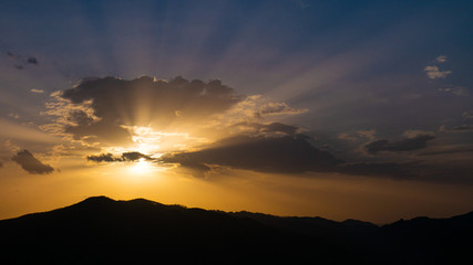 Beautiful landscape in the mountains at sunset. View of colorful sky with amazing clouds.