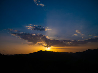 Obraz premium Beautiful landscape in the mountains at sunset. View of colorful sky with amazing clouds.