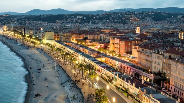 After sunset time lapse of Nice, France city lights and traffic. Nice evening view from Colline du Chateau view point. 4K
