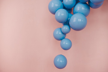 Blue balls on a pink background. Wedding or birthday decoration. Bright background