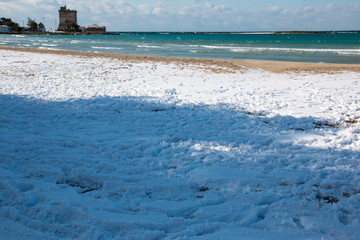 Ionian coast near Santo Isidoro after a exceptional snowfall, Salento, Italy