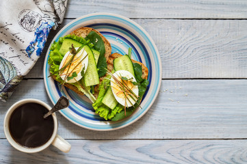 Toast of unleavened bread with cucumber, lettuce, egg and microgreen