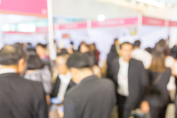 Blurred background of  public exhibition hall. Business tradeshow, job fair, or stock market. Organization or company event, commercial trading, or shopping mall marketing advertisement concept