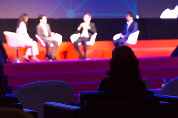 Audience is listening  the speakers on the stage in the conference hall or seminar meeting,...