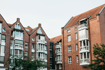 Residential buildings in Muenster in Germany. Ordinary houses in urban area. Apartment buildings in a row.