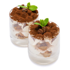 two portions Classic tiramisu dessert in a glass isolated on a white background with clipping path