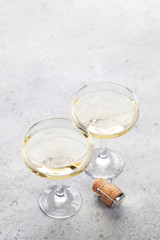 Champagne glasses on stone table
