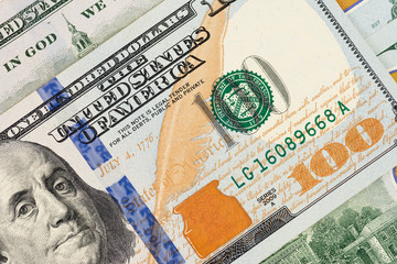 Closeup photo of a 100 dollar bill.