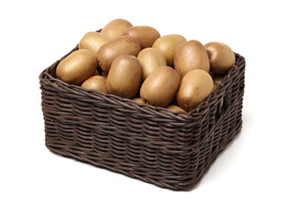 Whole and cut golden kiwifruit/ kiwi (Actinidia chinensis) on white 