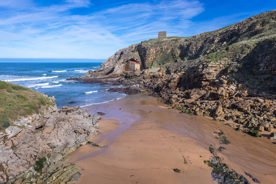 Aerial view on beach of Santa Justa on the Atlantic shore in Ubiarco village in northern Spain, view with hermitage and San Telmo medieval watchtower