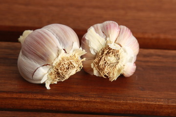 head of garlic on wooden background