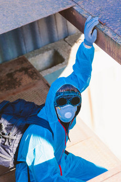 man environmental mask face pack disguise facemask bitmask protective overall blue sky orange rast plant factory disused catastrophe