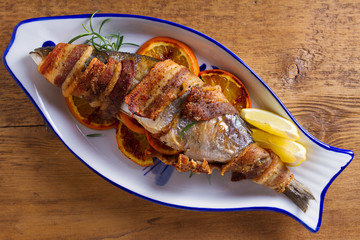 Grilled Bacon-Wrapped Whitefish. Fish wrapped with bacon. View from above, top